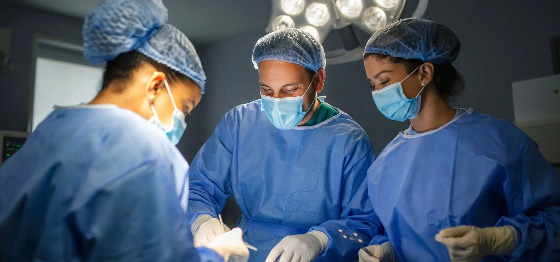 Surgeon performing colon cancer colectomy surgery